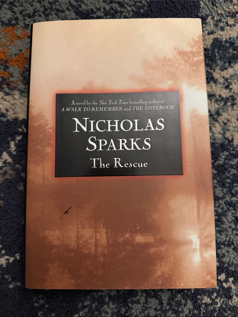 Nicholas Sparks "The Rescue" Paperback Book - Brown/Black Cover